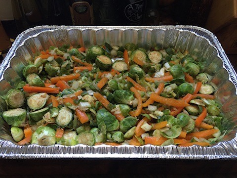 Large roasting tray filled with colorful vegetables